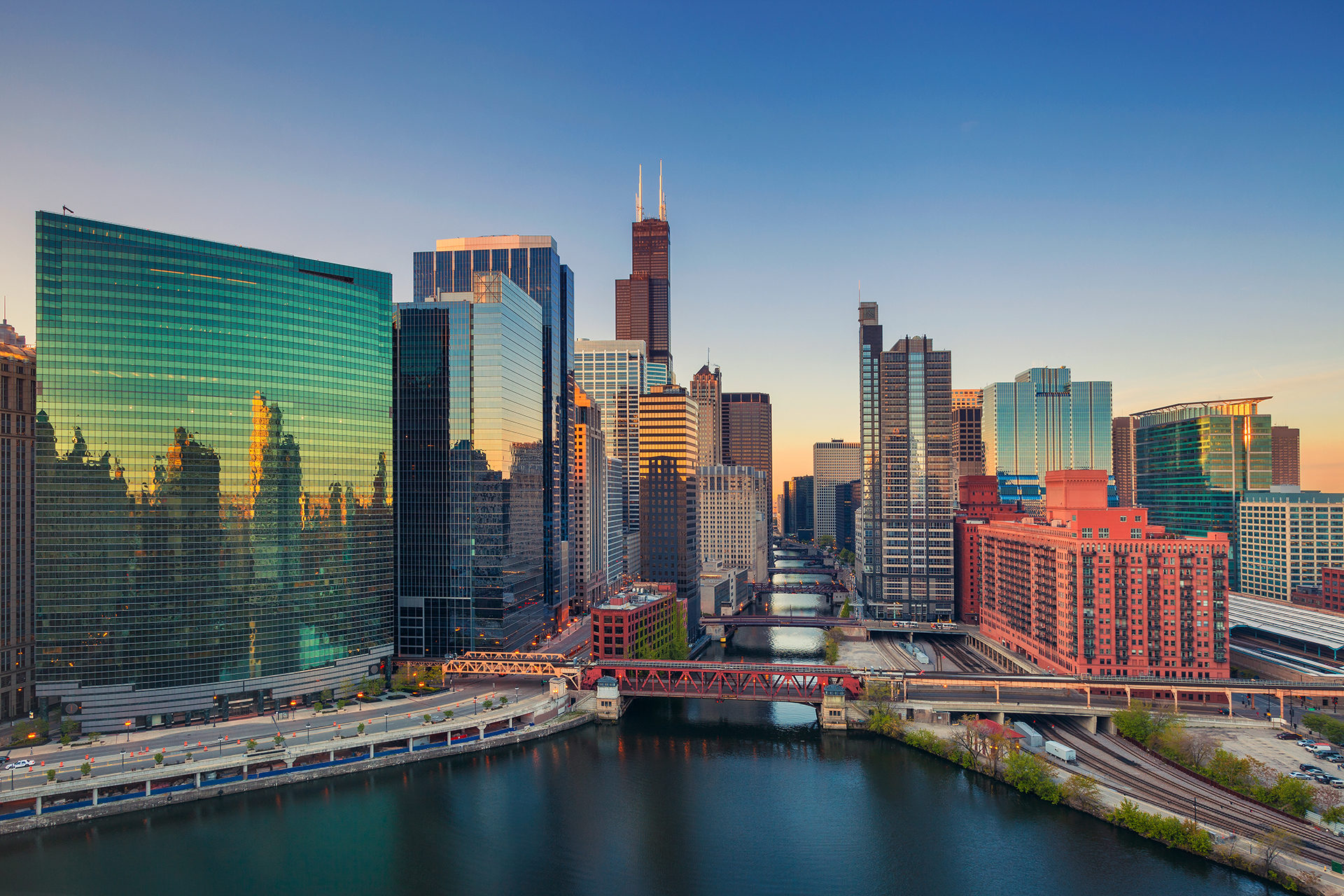 Chicago river and downtown buildings at sunset
